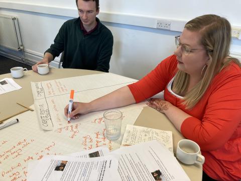 People taking part in an activity at a local knowledge exchange in Lancaster